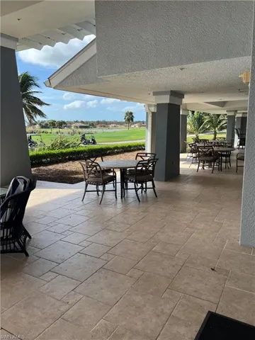 View of patio featuring outdoor dining area and golf course view