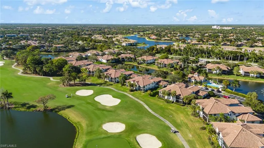 View of property location featuring a large body of water and nearby suburban area