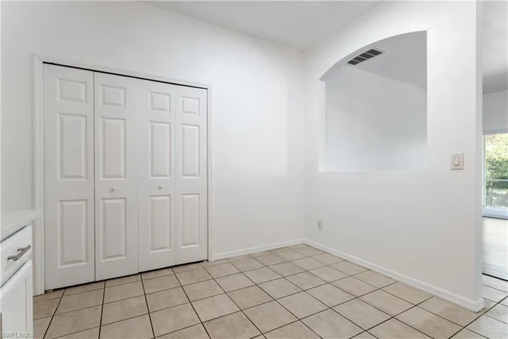 Neutral tile flooring, huge pantry