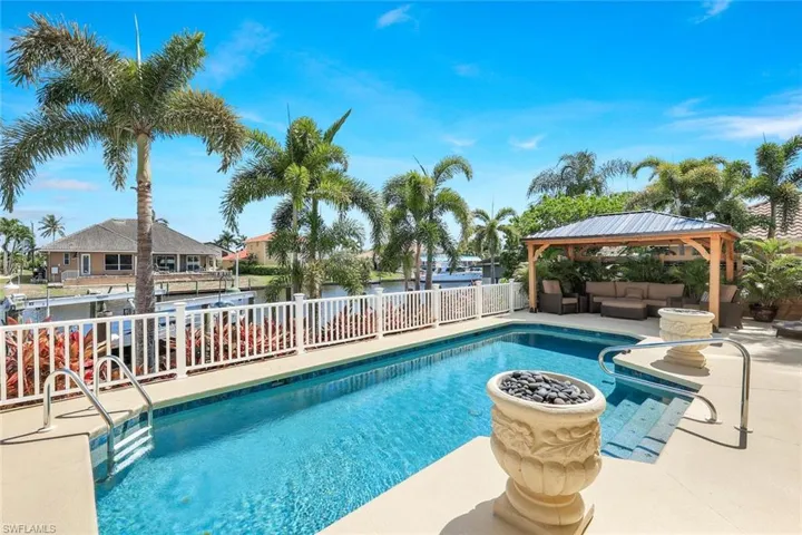 View of swimming pool featuring a patio area, an outdoor living space, and a gazebo