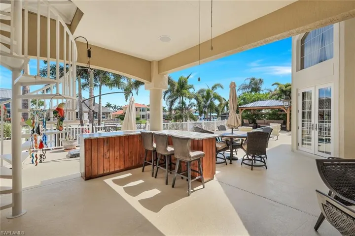 View of patio / terrace with french doors and exterior bar
