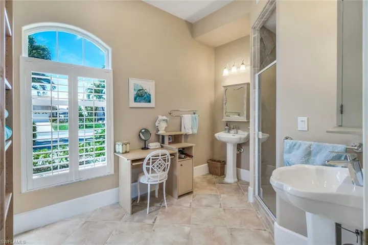 Bathroom featuring sink and tile floors