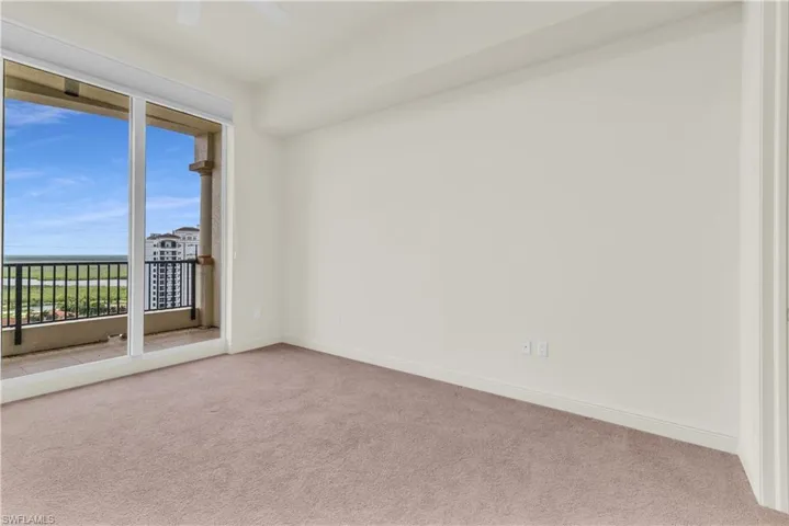 Unfurnished room with carpet