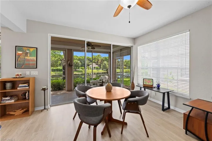 Dining area featuring light wood-style floors and ceiling fan