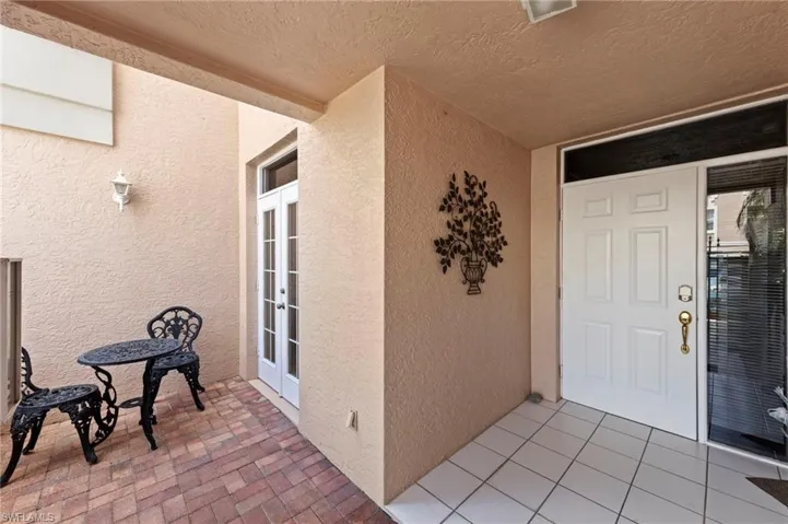 Entrance to property with french doors and stucco siding