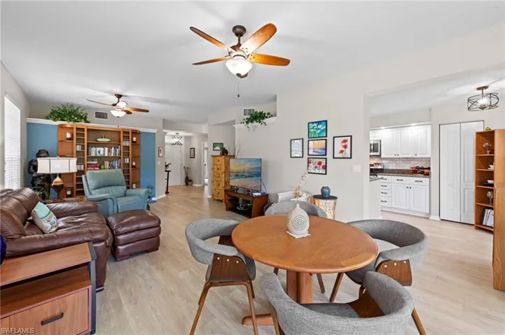Dining area featuring ceiling fan and light wood finished floors