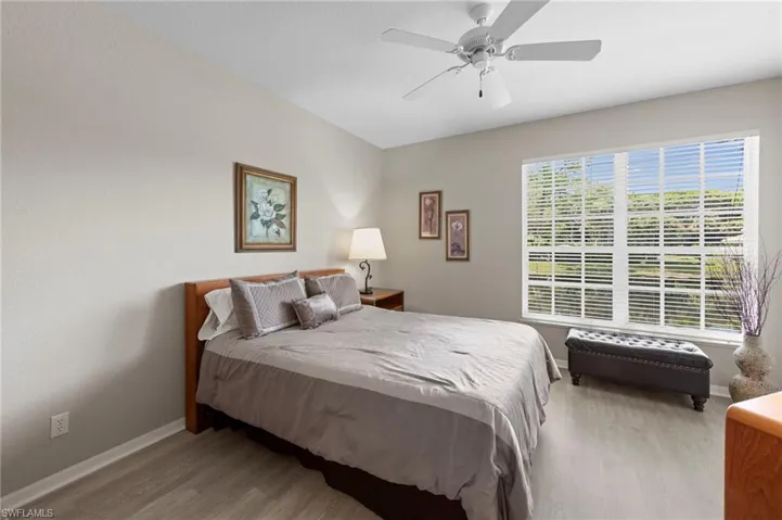 Bedroom featuring light wood-style floors and a ceiling fan