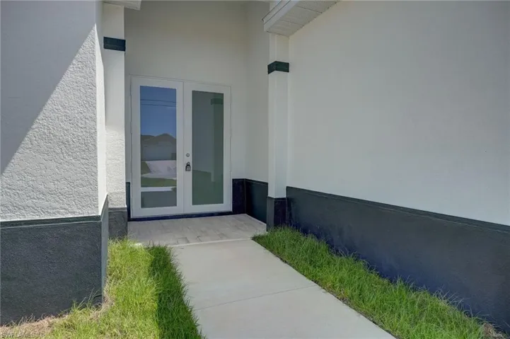 Entrance to property featuring french doors