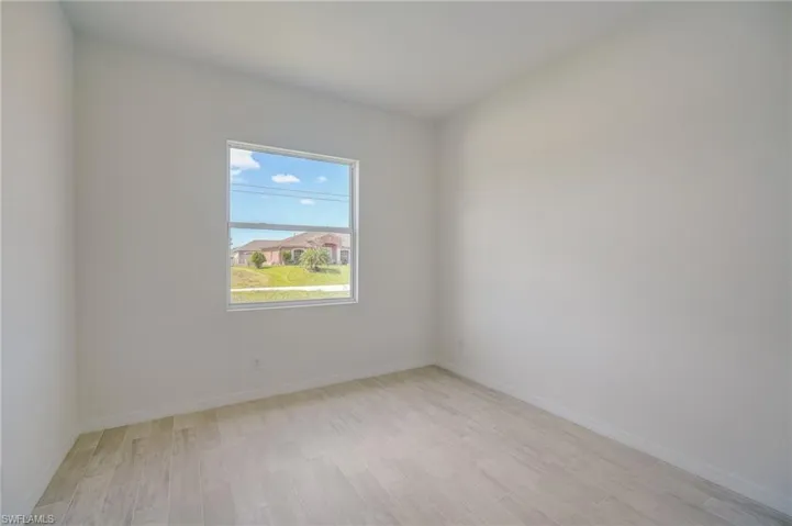 Unfurnished room with light hardwood / wood-style floors