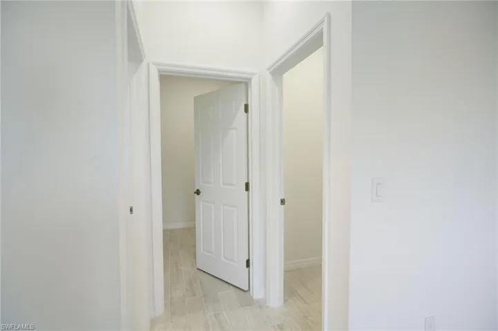 Hallway featuring light hardwood / wood-style flooring