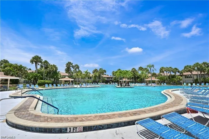 Community pool with a patio area