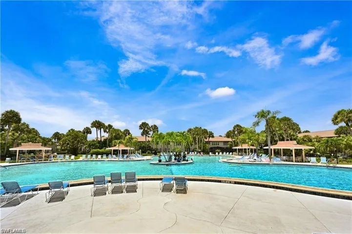 Community pool with a patio area and a gazebo