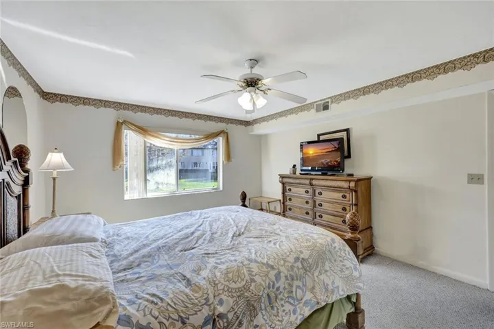 Bedroom with carpet floors and ceiling fan