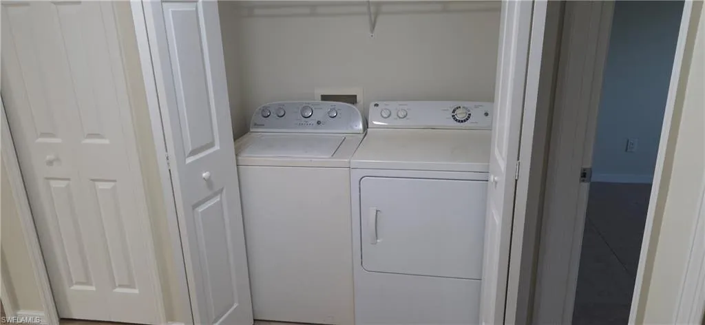 Laundry room featuring washing machine and clothes dryer
