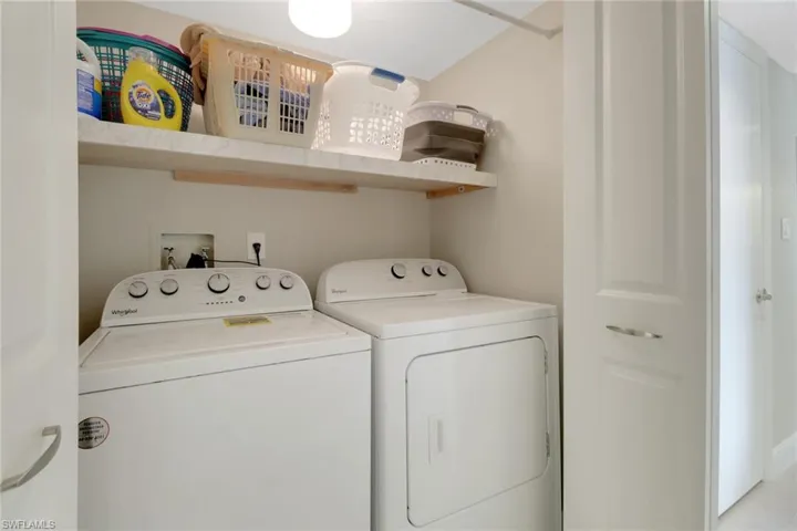 Laundry in unit featuring washer and dryer