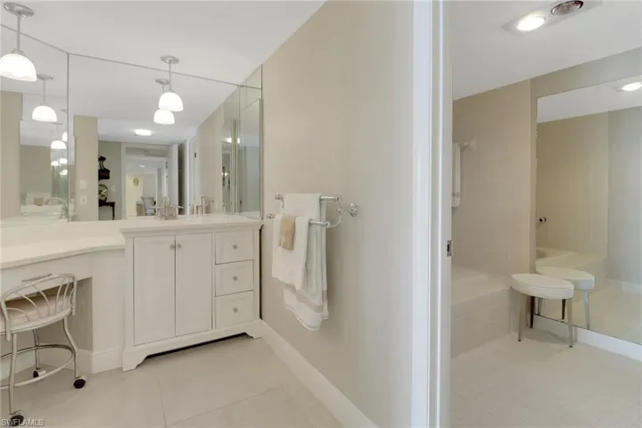 Bathroom with vanity and a shower with shower door