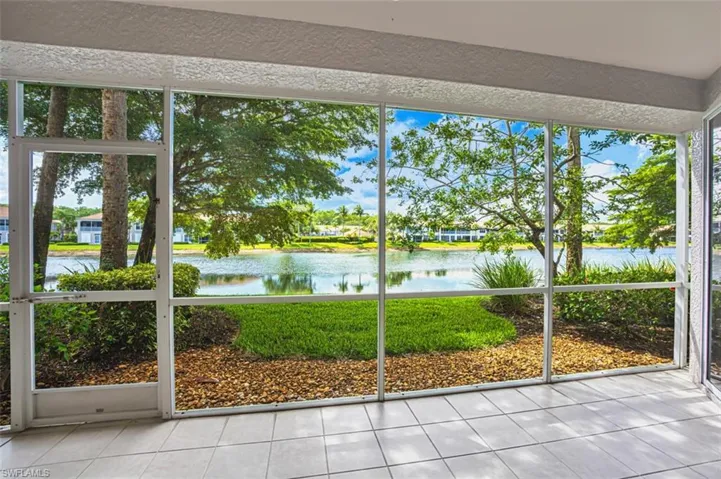 Unfurnished sunroom with a water view