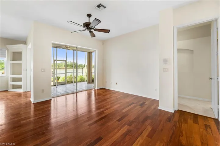 Wood-finish flooring throughout, with a ceiling fan fixture