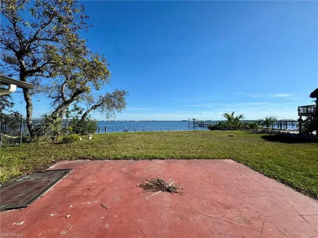 View of patio / terrace with a water view