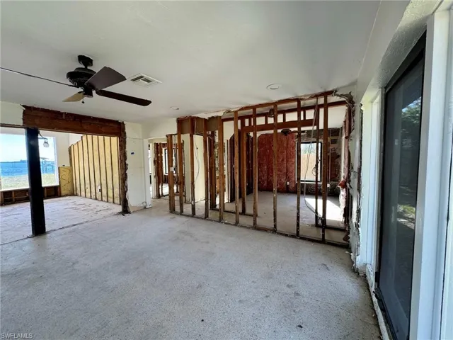 Miscellaneous room featuring a water view and ceiling fan