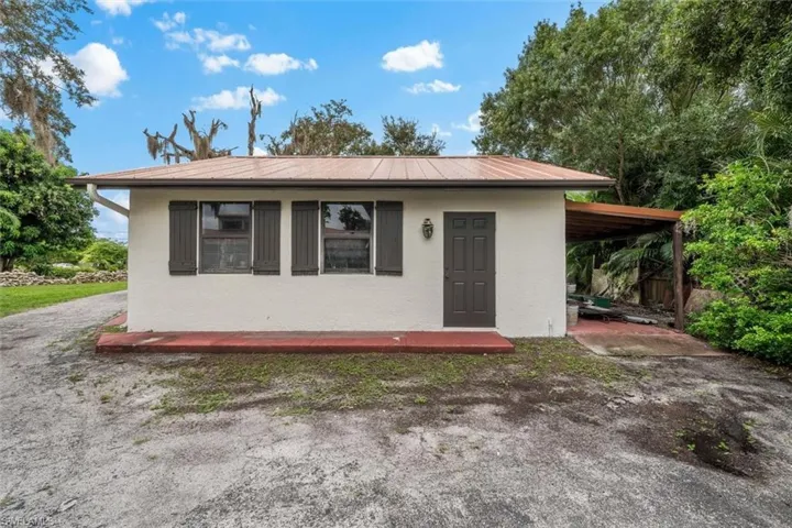 View of front facade with a carport