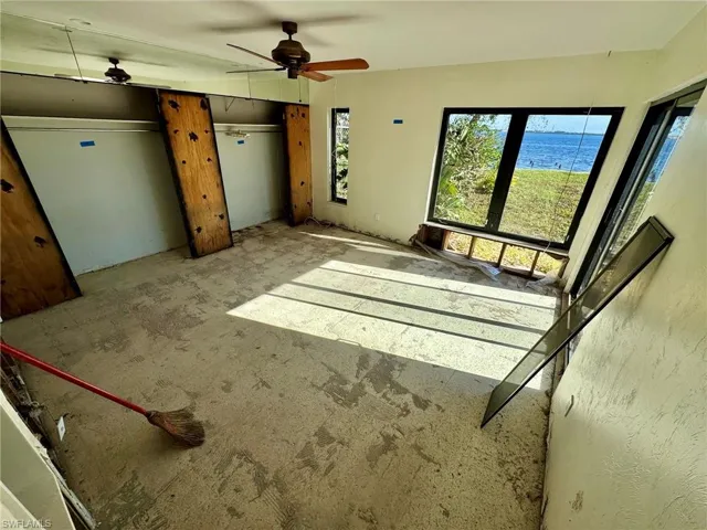 Unfurnished bedroom featuring ceiling fan