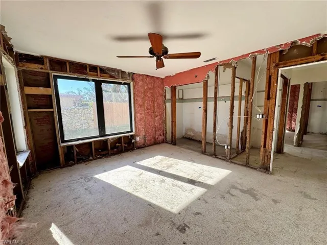 Unfurnished bedroom featuring ceiling fan