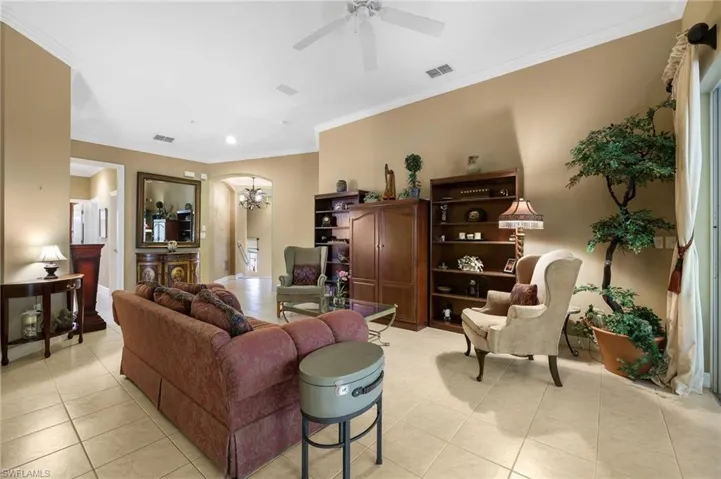 This inviting living room features sleek tile flooring that adds a touch of modern elegance while being easy to maintain.