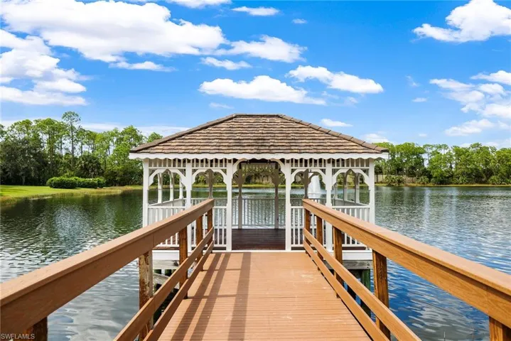 Overlook a pristine 15-acre fishing lake, complete with a charming pier.
