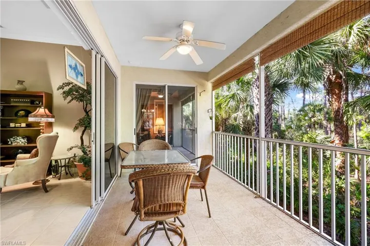 The living area opens to a private screened lanai with tranquil wooded preserve views.