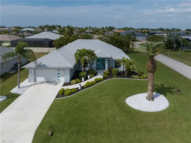 Beautifully landscaped, exqusitely furnished pool home ready for you to live the florida lifestyle