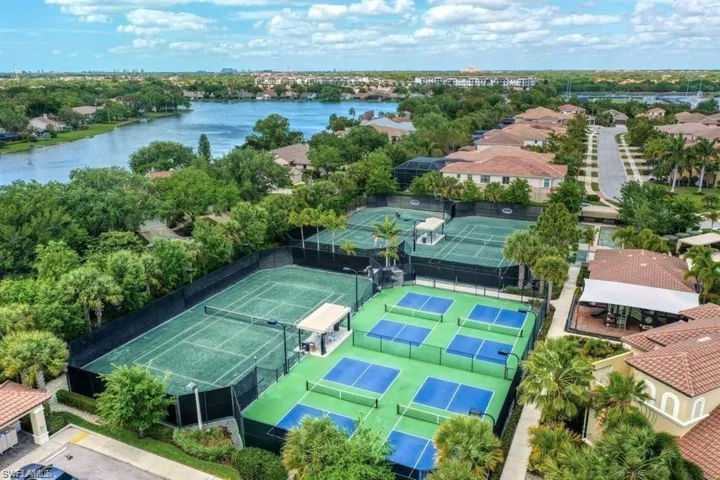 Birds eye view of property with a water view