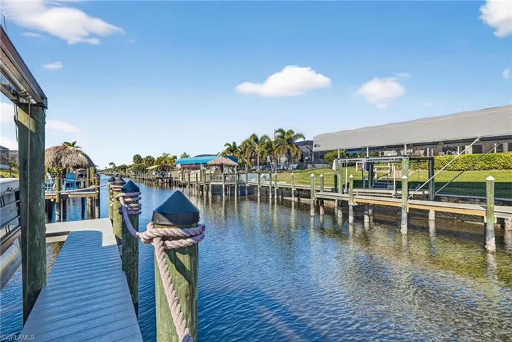 Dock featuring a water view and boat lift