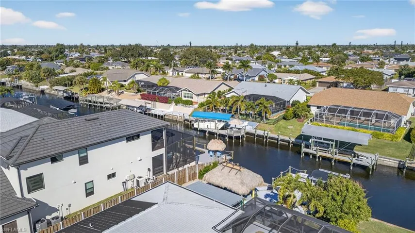 Aerial perspective of suburban area with a nearby body of water