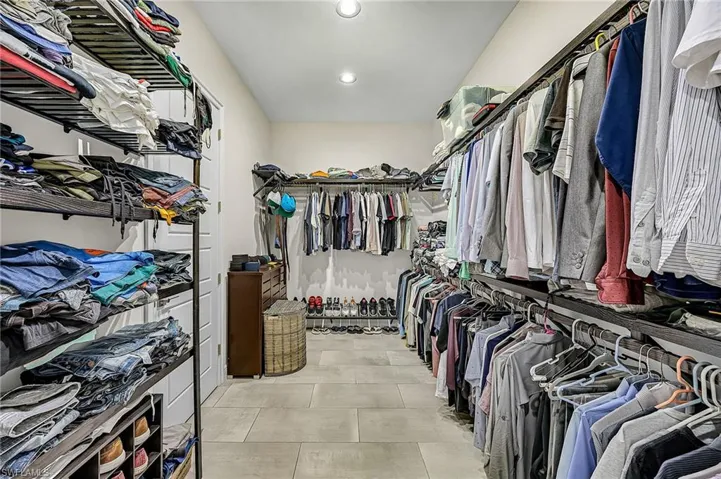 Master walk in closet with custom shelving