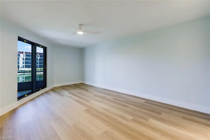 Unfurnished room with light wood-style floors and a ceiling fan