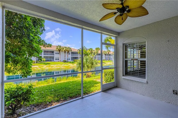 Unfurnished sunroom featuring a water view