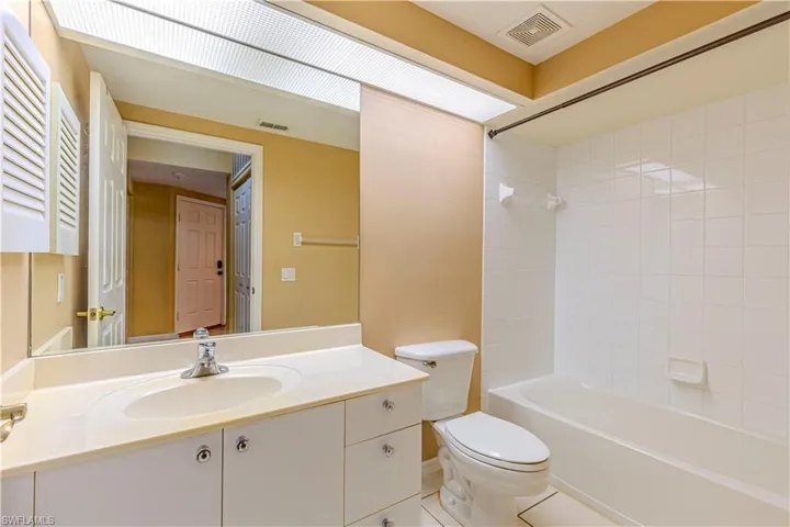 Full bathroom featuring vanity, shower / washtub combination, and tile patterned floors