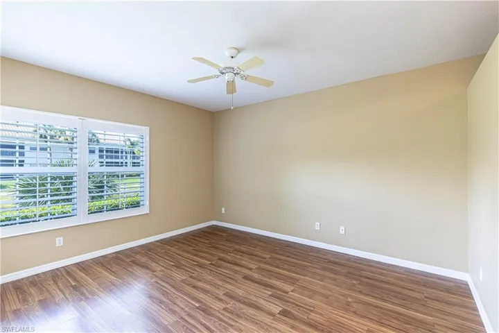 Spare room with ceiling fan and wood finished floors