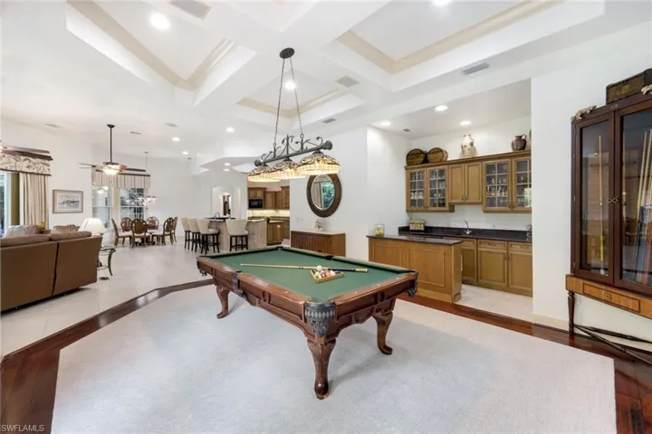 This spacious game room is a wonderful place to entertain including a wet bar!