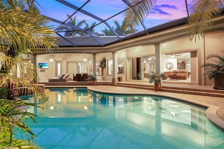 3080 sqft Lanai with pool framed by tropical landscaping.