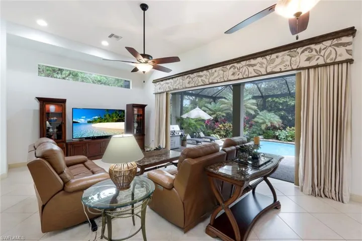 The family room opens up to the lanai for a wonderful indoor/outdoor living experience. The open floor plan allows this space to flow seamlessly to the game room, kitchen, and dining area.