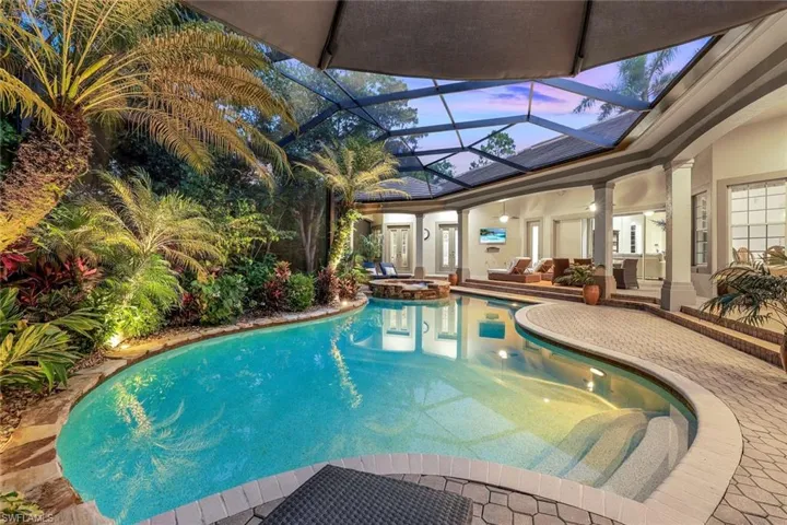 3080 sqft Lanai with pool framed by tropical landscaping.