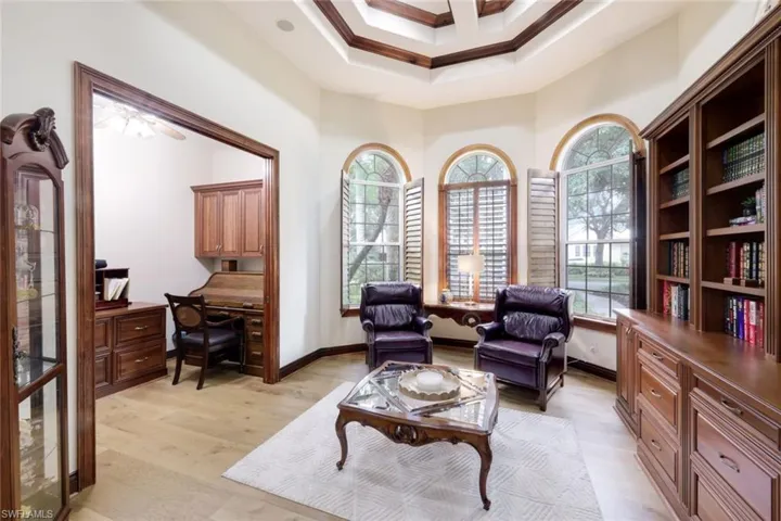 The spacious den includes a bay window with views of the entry fountain and front landscaping, as well as a beautiful built in cabinet. This room also includes a nook for office space, or additional storage space!