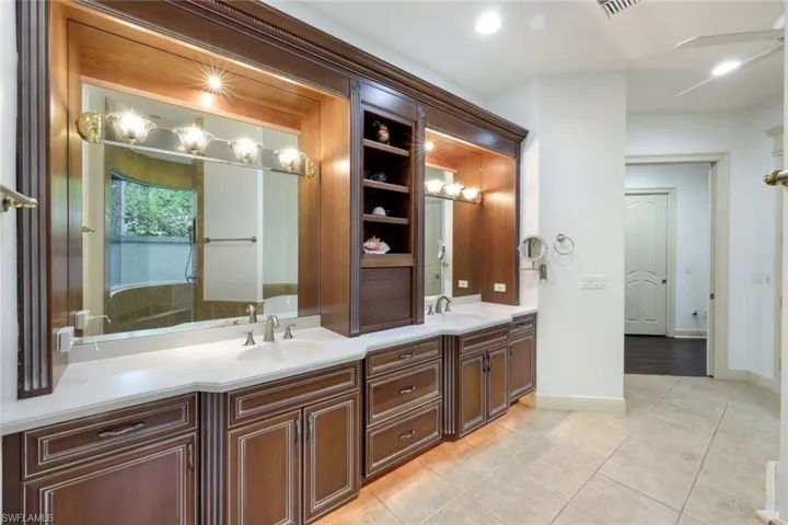 The primary ensuite bathroom includes a walk-in shower, soaking tub, and private outdoor garden area.
