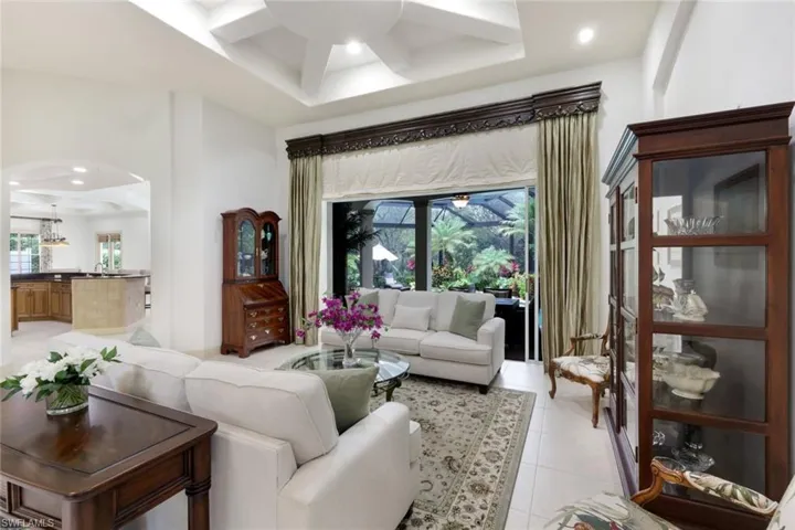 Entryway opens up to the great room with soaring ceilings and views onto the lanai.