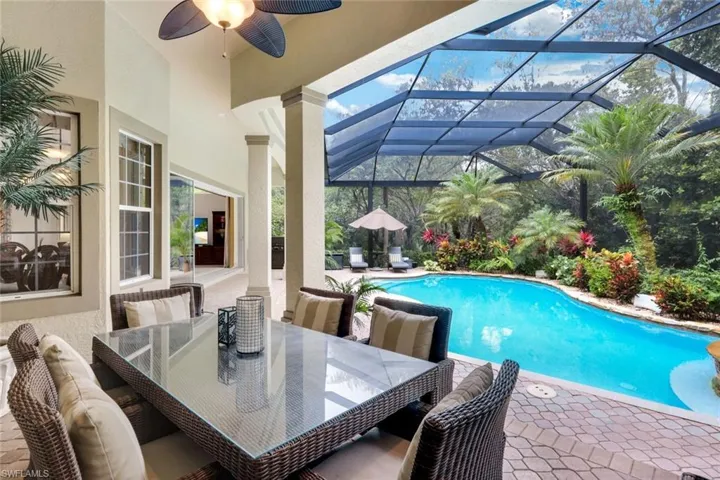 The lanai is impressive and inviting with plenty of space to grill, dine, or relax by the pool, or soak in the hot tub.