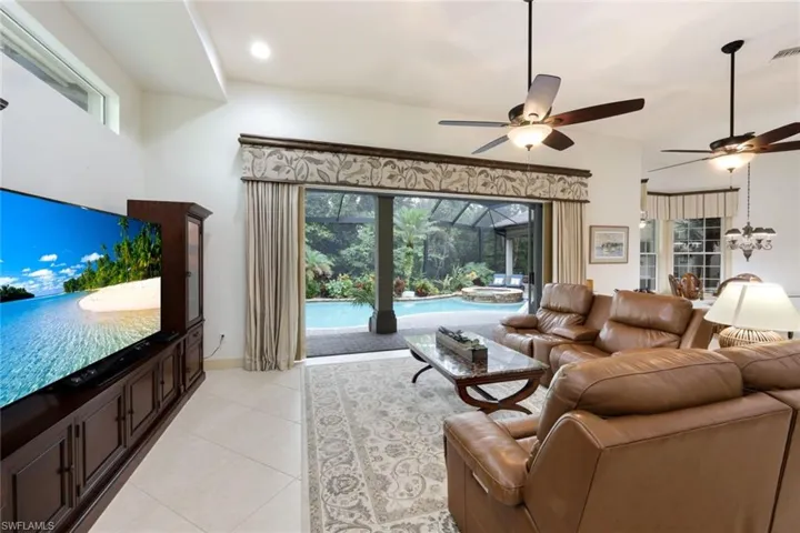 The family room opens up to the lanai for a wonderful indoor/outdoor living experience. The open floor plan allows this space to flow seamlessly to the game room, kitchen, and dining area.