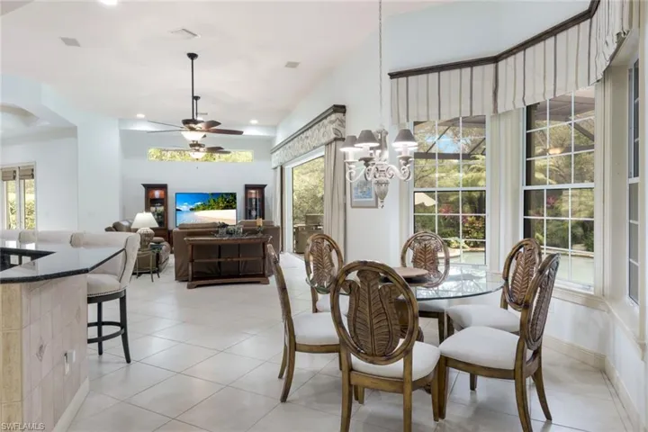 A bright bay window frames this dining area, just off of the kitchen.