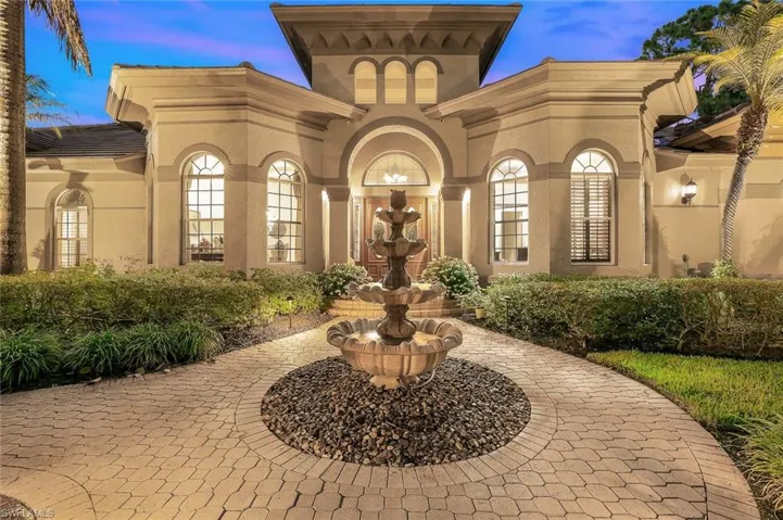 Inviting sounds of the tiered fountain welcome you as you enter the home.